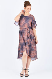 Model Lisa wearing size 10 of the Animal Wrap Dress in colour Animal, from the front, showing the whole outfit