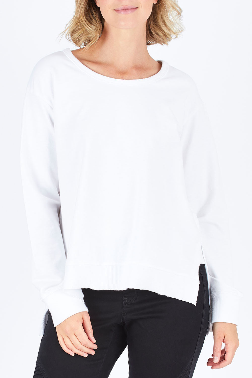 Model Chelsea wearing size S of the Ulverstone Sweater in colour White (White), from the front, cropped image