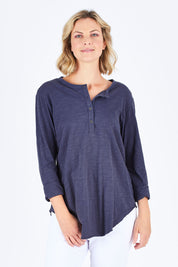 Model Chelsea wearing size S of the Cambridge Henley in colour Indigo (Blue), from the front, cropped image