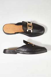 A model wearing size 37 of the Lifeline Slide in colour Black (Black), from the front, showing the whole outfit