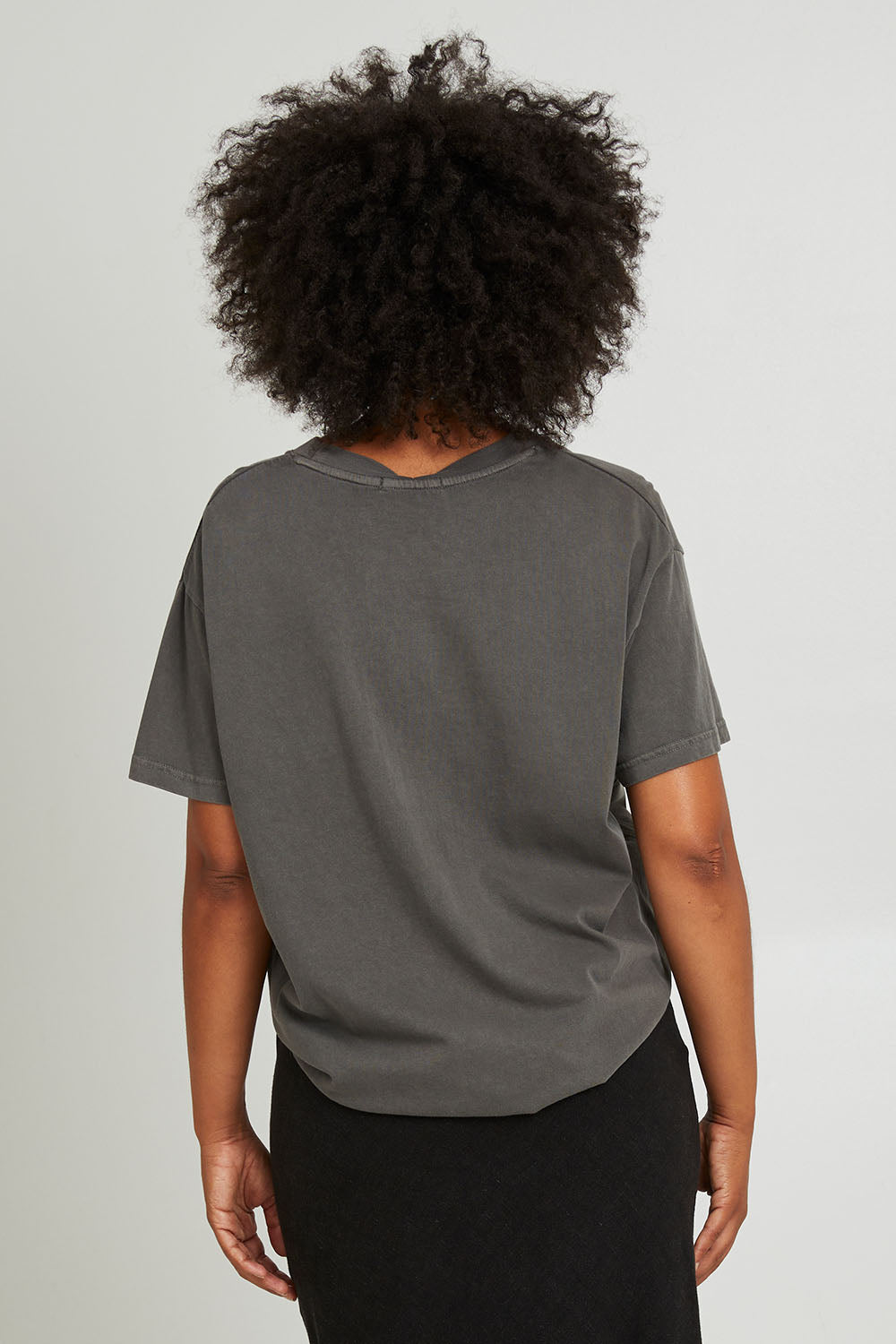 Model Olivia wearing size 10 of the Living Life Standard Tee in colour Charcaol (Grey), from the back