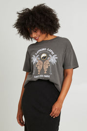 Model Olivia wearing size 10 of the Living Life Standard Tee in colour Charcaol (Grey), from the front, cropped image