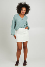 Model Olivia wearing size 10 of the Emma Cord Skirt in colour Vwhite (White), from the front, showing the whole outfit