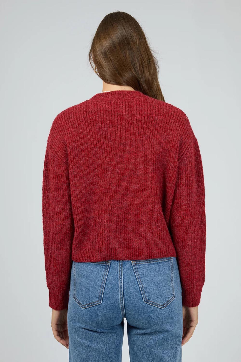 A model wearing the Jordana Knit in colour Scarlet (Red), from the back