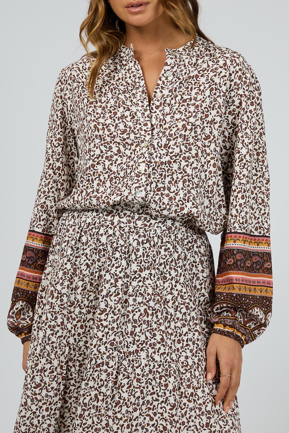 A model wearing the Honey Floral Shirt in colour Print, from the front, cropped image