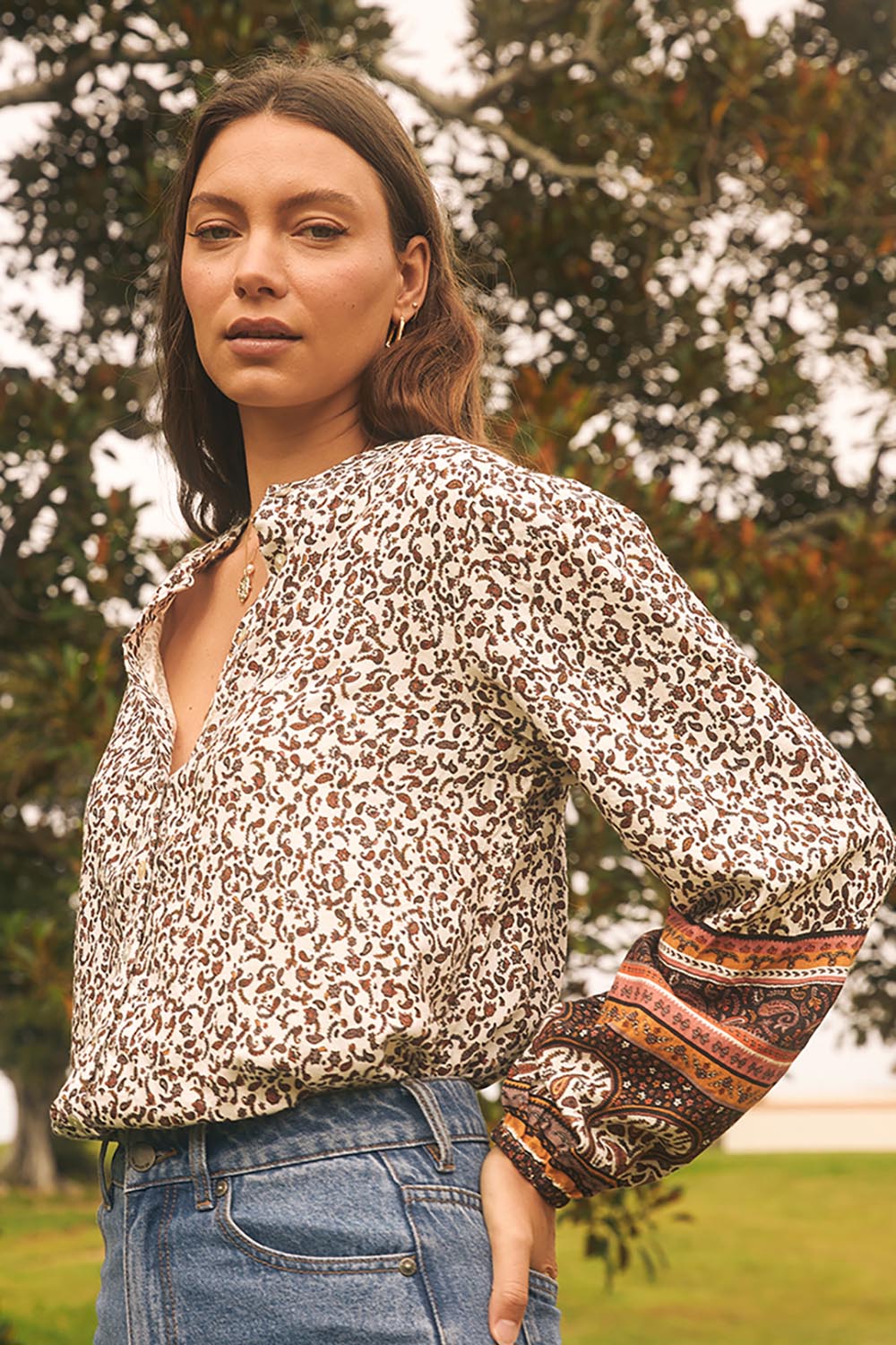 A model wearing the Honey Floral Shirt in colour Print, from the front, showing the whole outfit