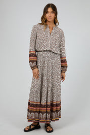 A model wearing the Honey Floral Shirt in colour Print, from the front, showing the whole outfit