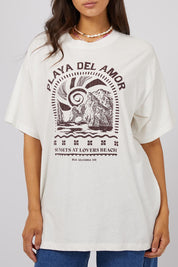 A model wearing the Solar Oversized Tee in colour Vivwhite (White), from the front, cropped image