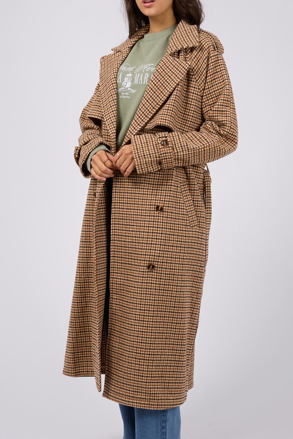 A model wearing the Charlotte Trench in colour Multi, from the front, cropped image