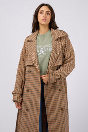 A model wearing the Charlotte Trench in colour Multi, from the front, cropped image