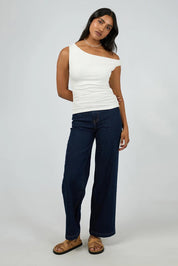 A model wearing the Kylie Off Shoulder Top in colour Vinwhite (White), from the front, showing the whole outfit
