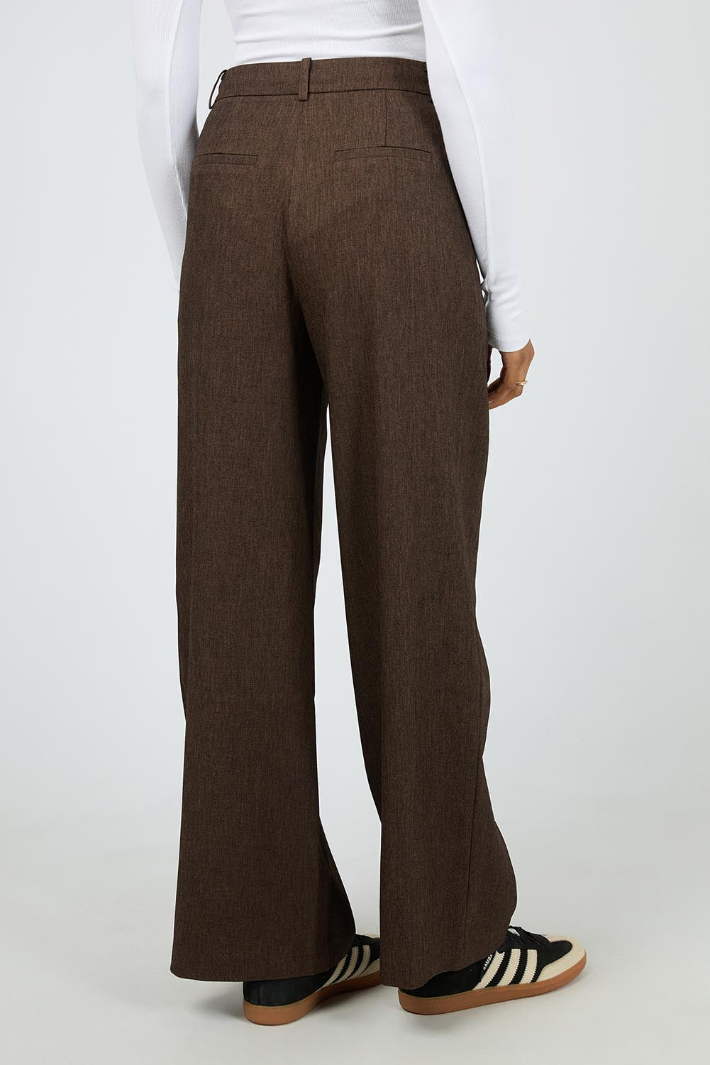 A model wearing the Romy Wide Leg Pant in colour Brown, from the back