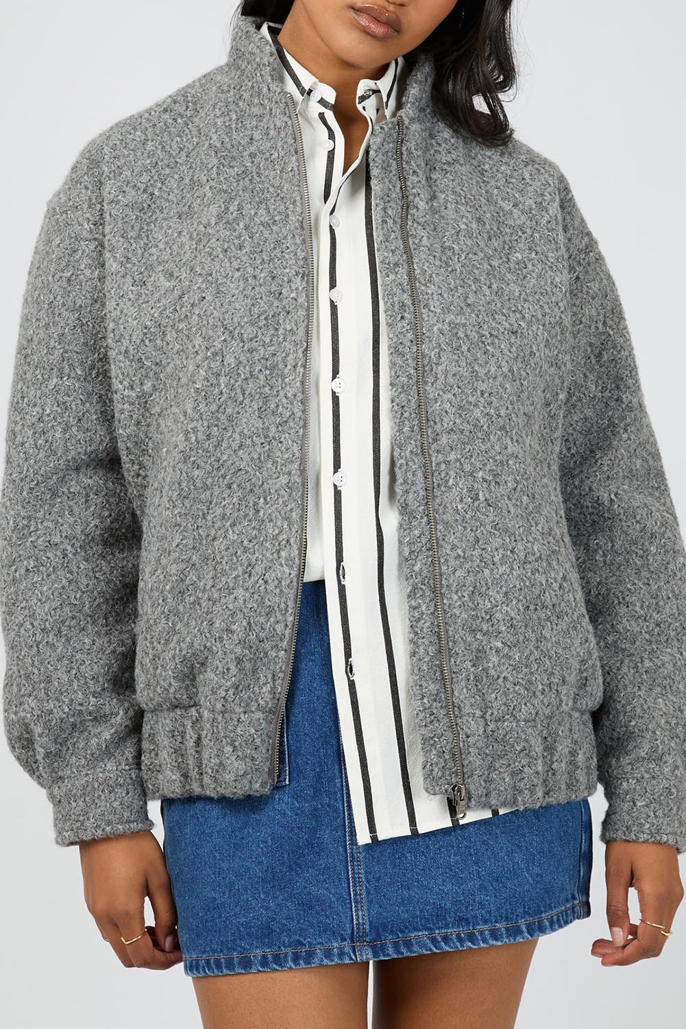 A model wearing the Tahlea Bomber Jacket in colour Greymarle (Grey), from the front, cropped image