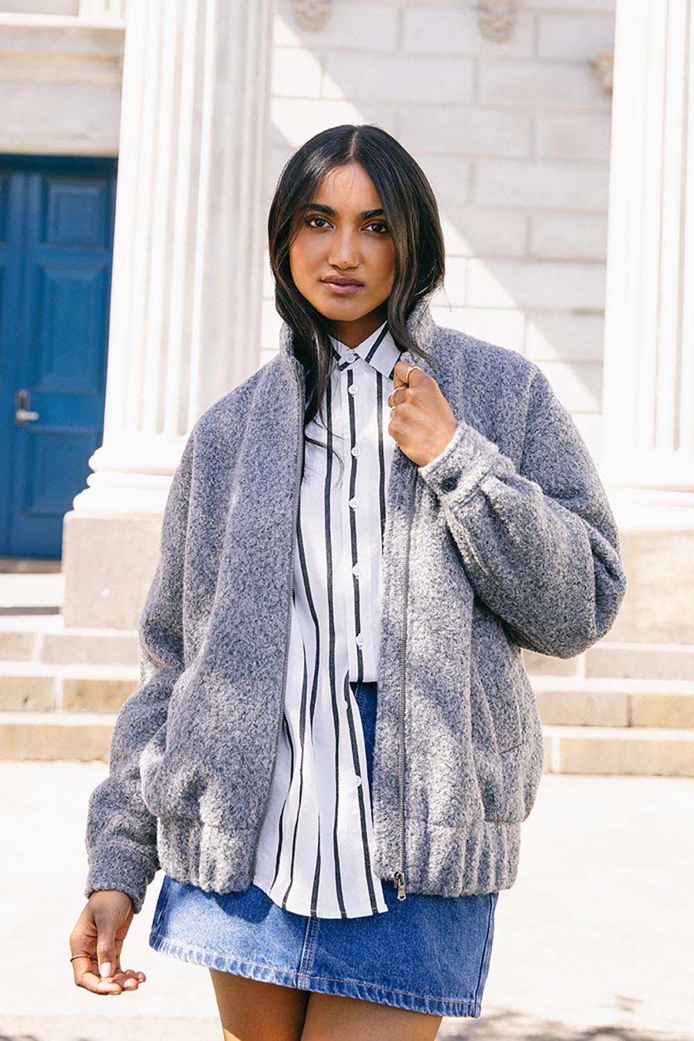 A model wearing the Tahlea Bomber Jacket in colour Greymarle (Grey), from the front, showing the whole outfit