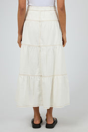 A model wearing the Coco Denim Maxi Skirt in colour Vinwhite (White), from the back