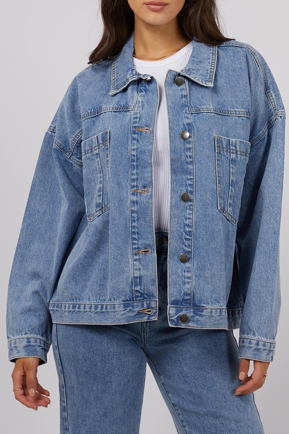 A model wearing the Sydney Jacket in colour Lightblue (Blue), from the front, cropped image