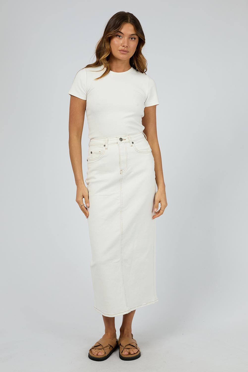 A model wearing the Ray Denim Comfort Maxi Skirt in colour White (White), from the front, showing the whole outfit