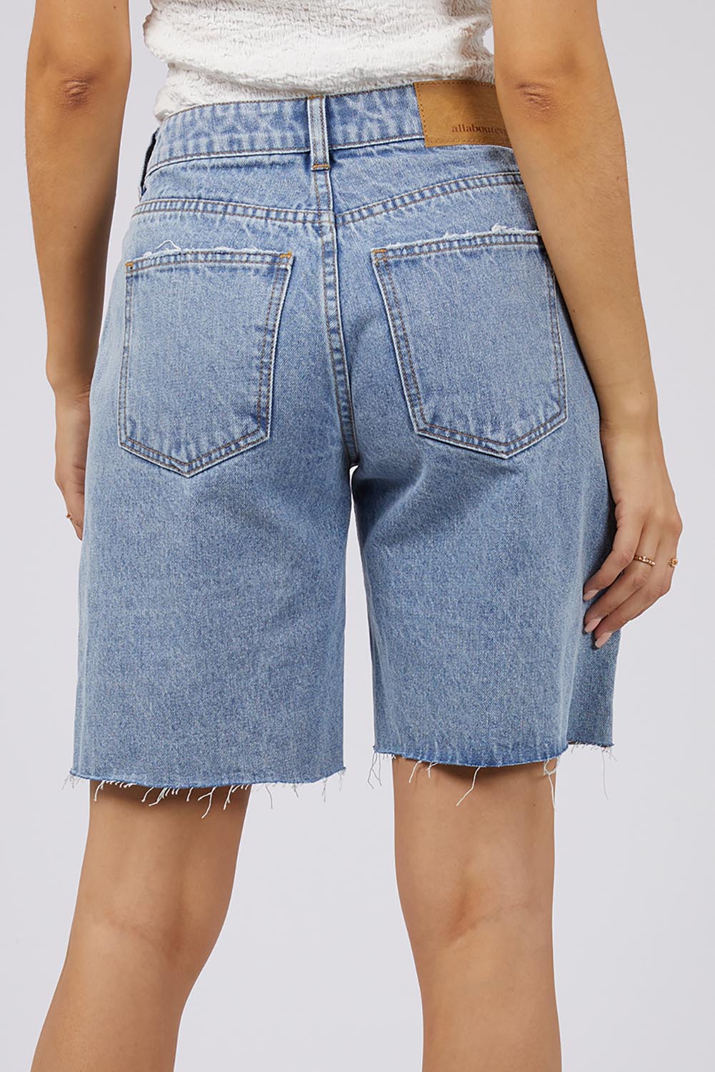A model wearing the Lexie Denim Short in colour Lblue (Blue), from the back