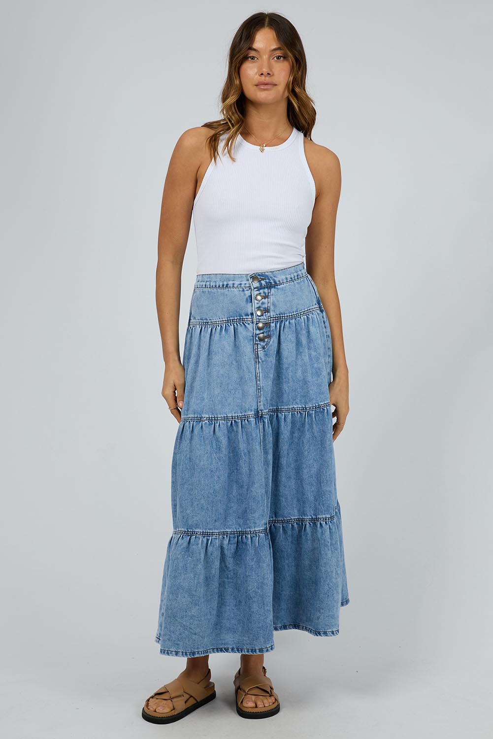 A model wearing the Coco Denim Maxi Skirt in colour Lightblue (Blue), from the front, showing the whole outfit