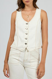 A model wearing the Korin Denim Vest in colour Vwhite (White), from the front, cropped image