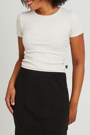 Model Olivia wearing size 10 of the Eve Rib Baby Tee in colour Oat, from the front, cropped image