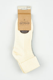 A model wearing the Organic Cotton Cuffed Rib Crew Sock 2 Pack in colour Meringrey, from the front, showing the whole outfit