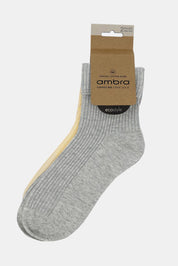 A model wearing the Organic Cotton Cuffed Rib Crew Sock 2 Pack in colour Meringrey, from the front, showing the whole outfit
