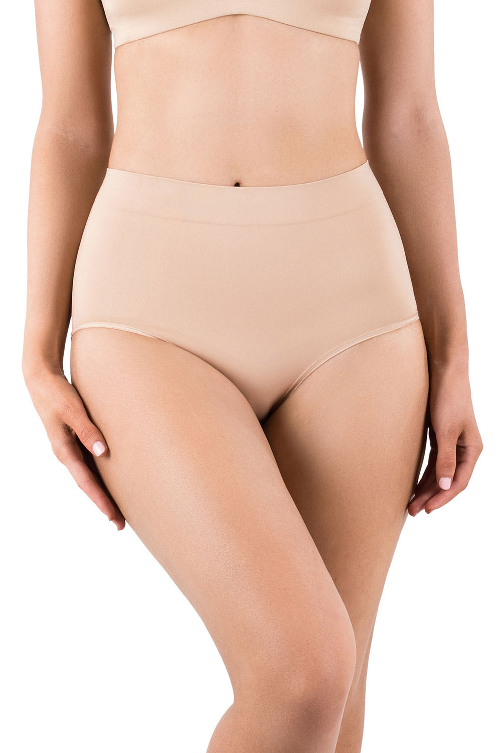 A model wearing the Powerlite Full Brief in colour Rose Beige, from the front, cropped image