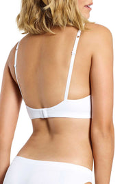 A model wearing the Seamless Singles Wirefree Bra in colour White (White), from the back