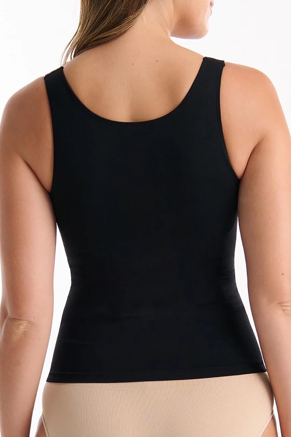 A model wearing the Reversible Shelf Bra Tank in colour Black (Black), from the back