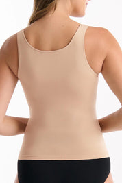 A model wearing the Reversible Shelf Bra Tank in colour Rosebeige, from the back