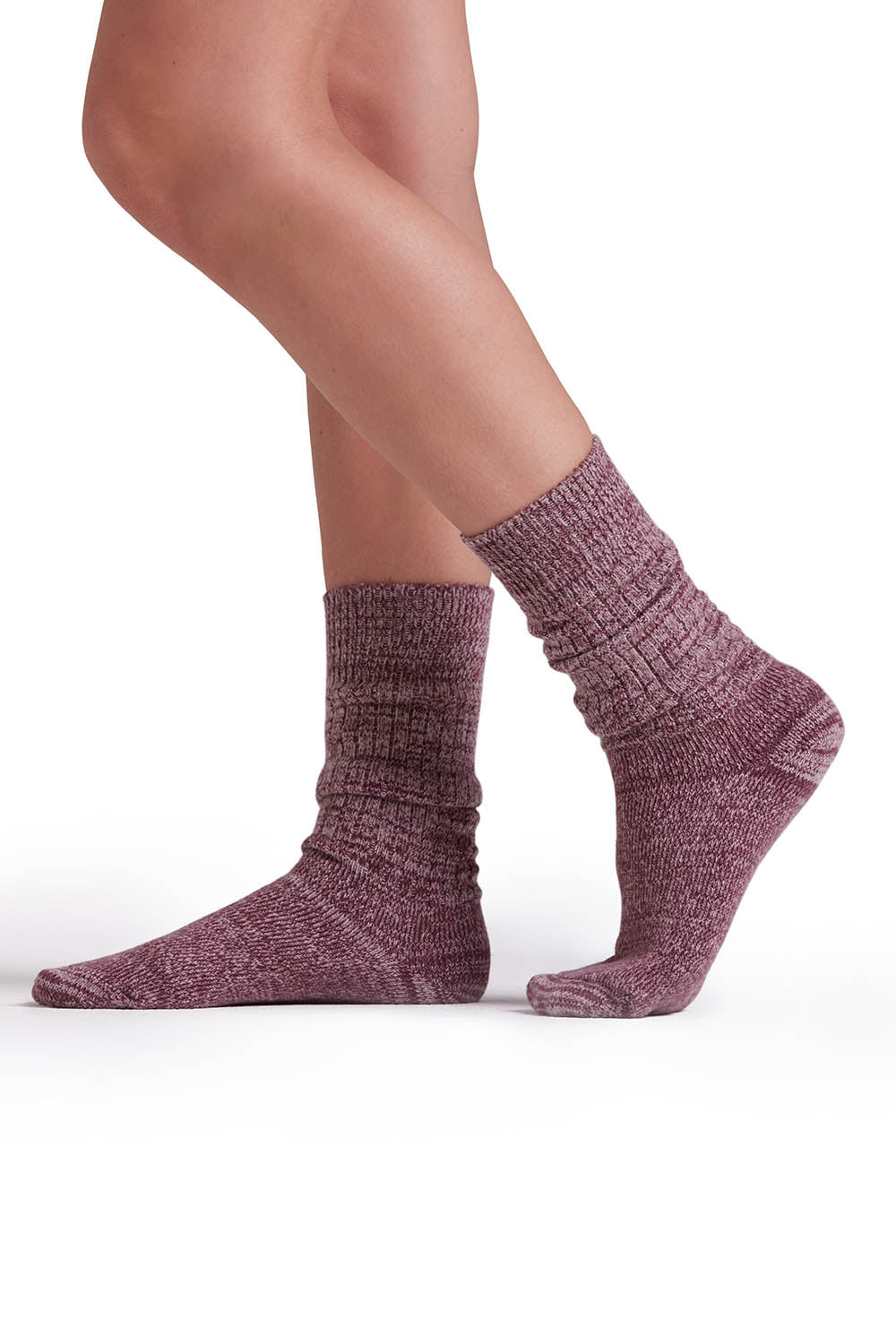 A model wearing the Recycled Polyester Slouch Sock in colour Sangria (Purple), from the front, cropped image