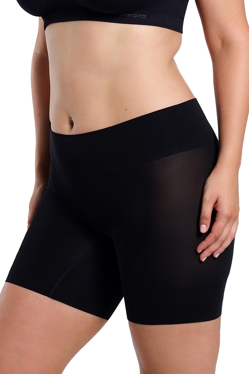 A model wearing the Curvesque Antiin colourChafing Short - Black (Black), from the front, cropped image