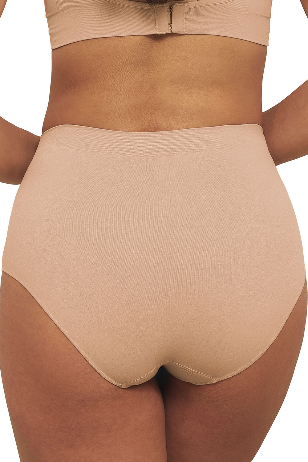 A model wearing the Bare Essentials Full Brief in colour Rosebeige, from the back