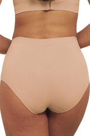 A model wearing the Bare Essentials Full Brief in colour Rosebeige, from the back