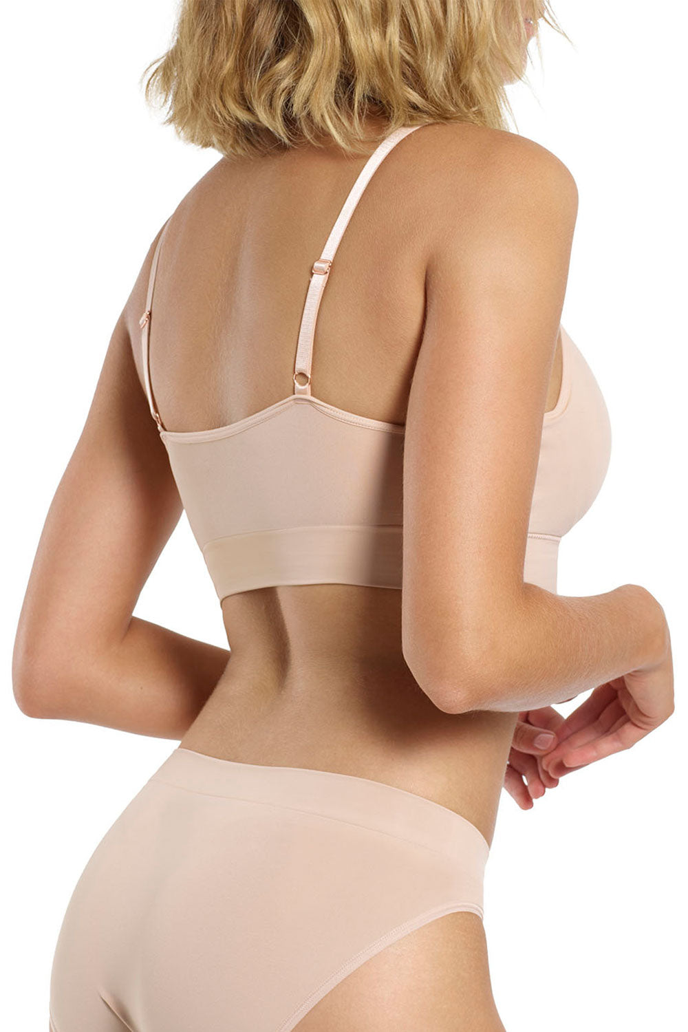 A model wearing the Bondi Bare Longline Wirefree Bra in colour RoseBeige, from the back