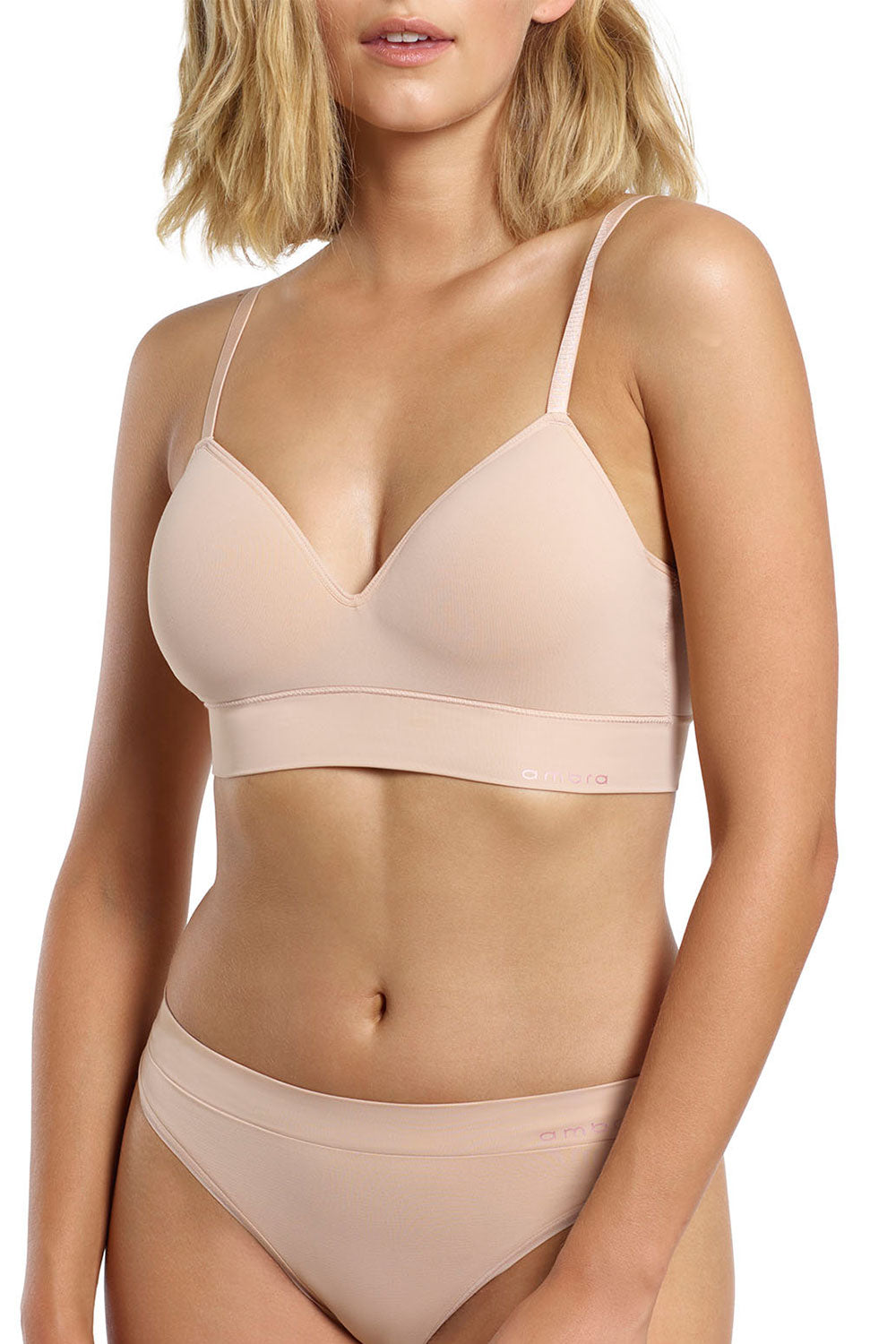 A model wearing the Bondi Bare Longline Wirefree Bra in colour RoseBeige, from the front, cropped image