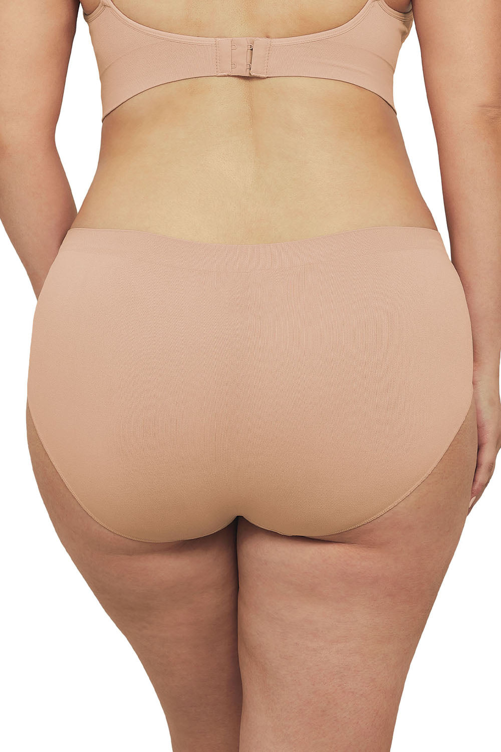 A model wearing the Bare Essentials Midi Brief in colour Rosebeige, from the back