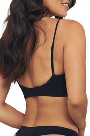 A model wearing the Bare Essentials Padded Wirefree Bra in colour Black (Black), from the back
