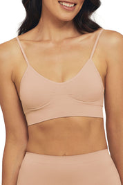 A model wearing the Bare Essentials Padded Wirefree Bra in colour Rosebeige, from the front, cropped image