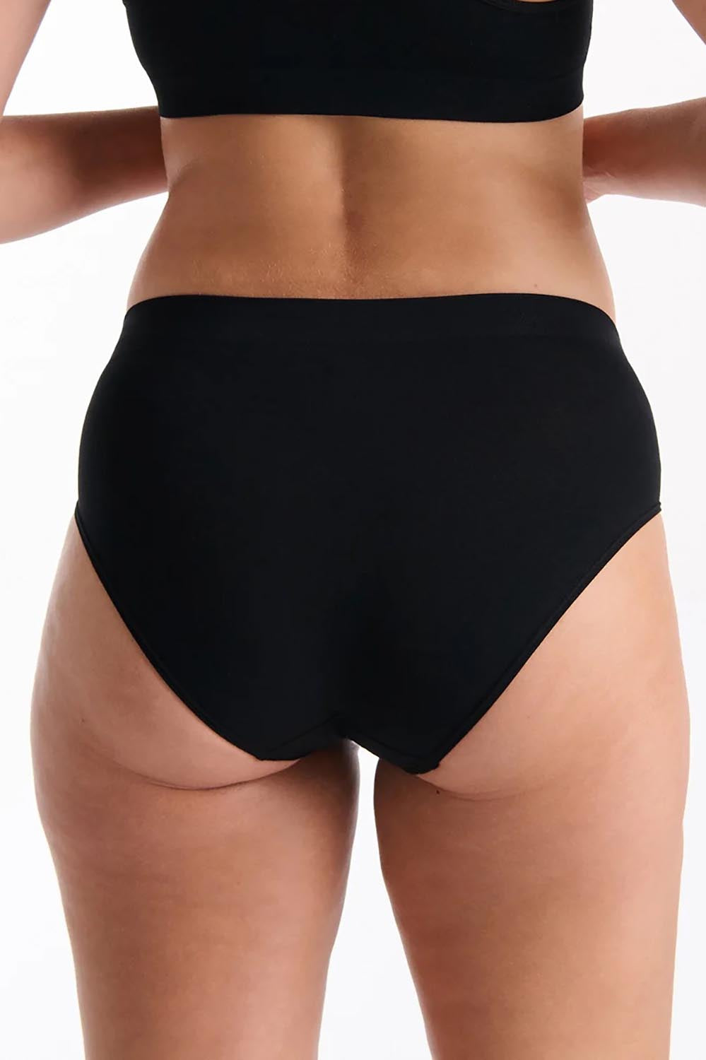 A model wearing the Pure Basics Modal Midi Briefs 2 Pack in colour Black (Black), from the back