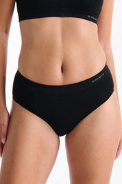 A model wearing the Pure Basics Modal Midi Briefs 2 Pack in colour Black (Black), from the front, cropped image