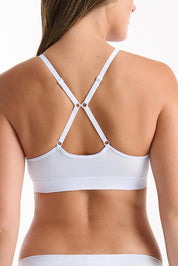 A model wearing the Pure Basics Triangle Modal Bralette in colour Aurablue (Blue), from the back