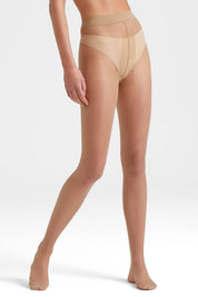 A model wearing the Sheer To Waist Tights in colour Natural, from the front, cropped image