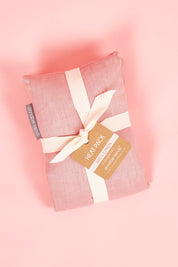 A model wearing size OneSize of the Australian Made Linen Heat Pillow in colour Rosepink (Pink), from the front, showing the whole outfit