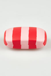 A model wearing the Travel Safe Keeper Box in colour Redstripe (Red), from the front, showing the whole outfit