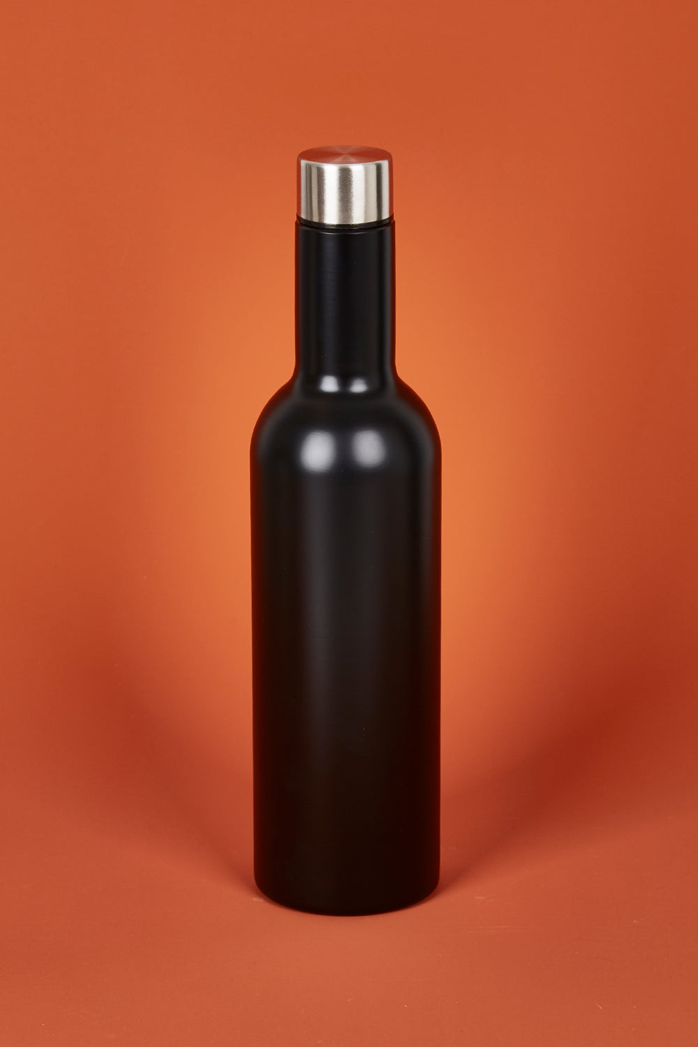 A model wearing the Matte Wine Bottle in colour Black (Black), from the front, showing the whole outfit