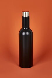 A model wearing the Matte Wine Bottle in colour Black (Black), from the front, showing the whole outfit