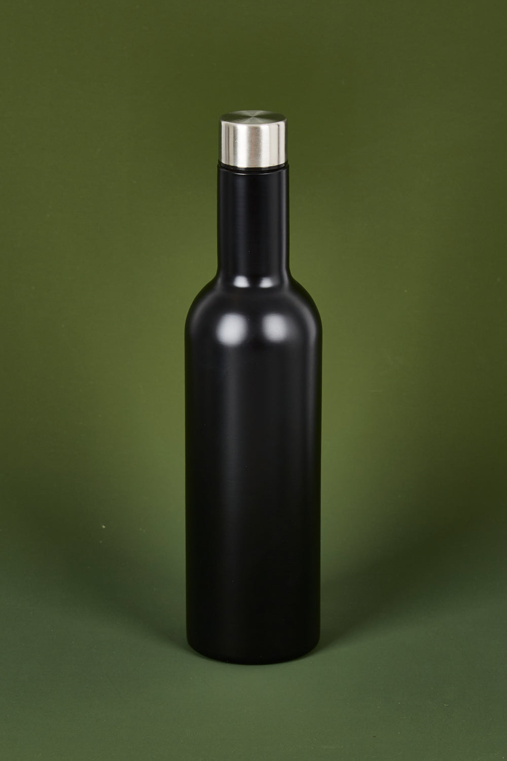 A model wearing the Matte Wine Bottle in colour Black (Black), from the front, showing the whole outfit