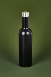 A model wearing the Matte Wine Bottle in colour Black (Black), from the front, showing the whole outfit